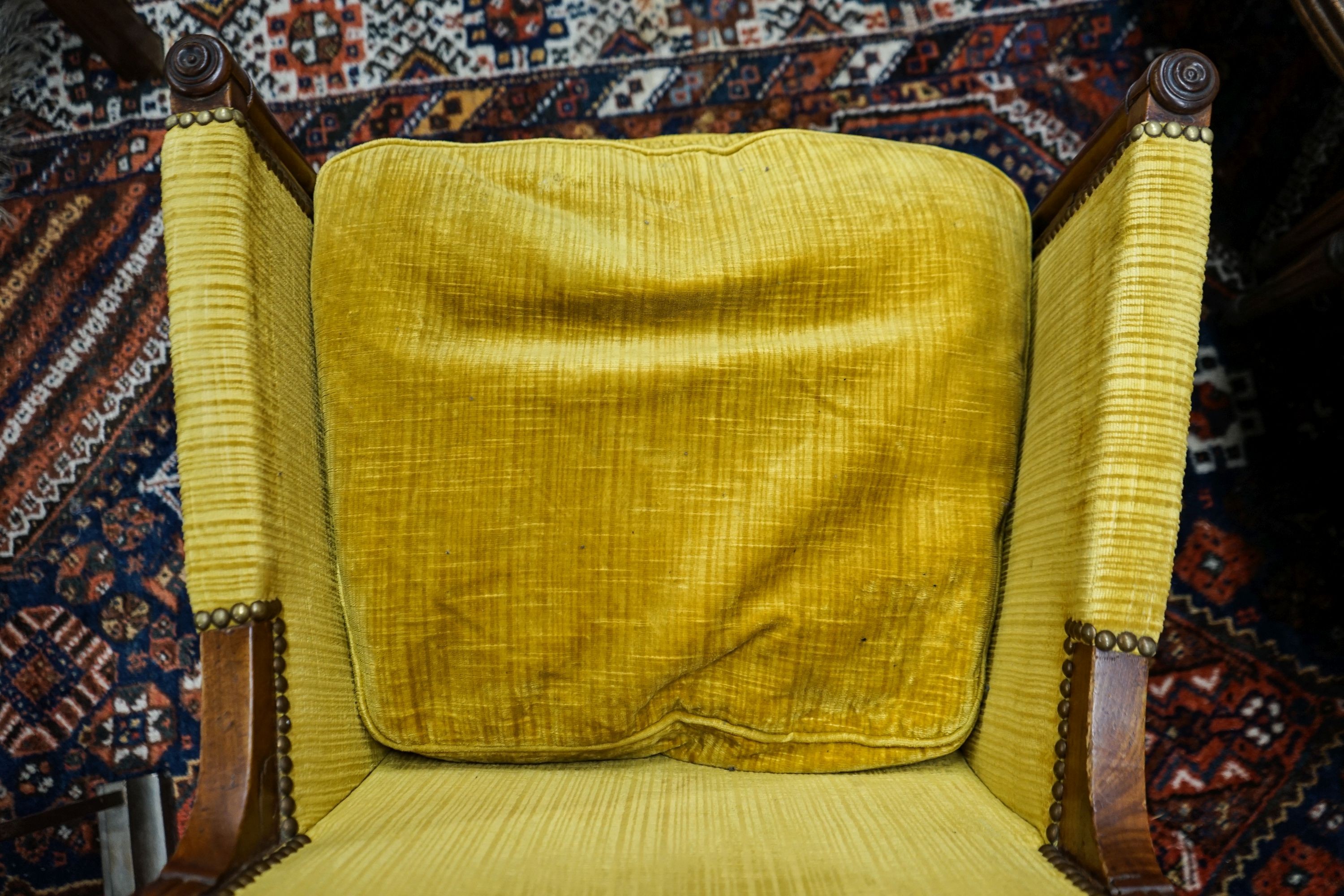 An Empire fruitwood bergere, c.1840, width 62cm, depth 52cm, height 90cm